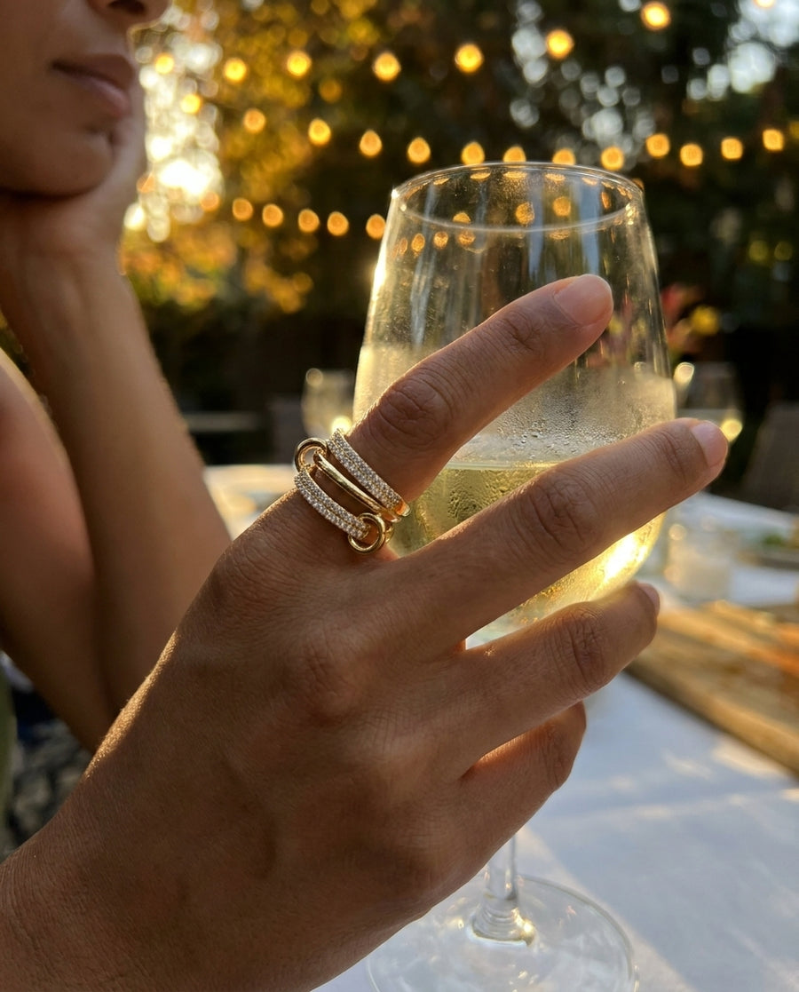 Camelia Sovereign Layers Ring at an outdoor dinner