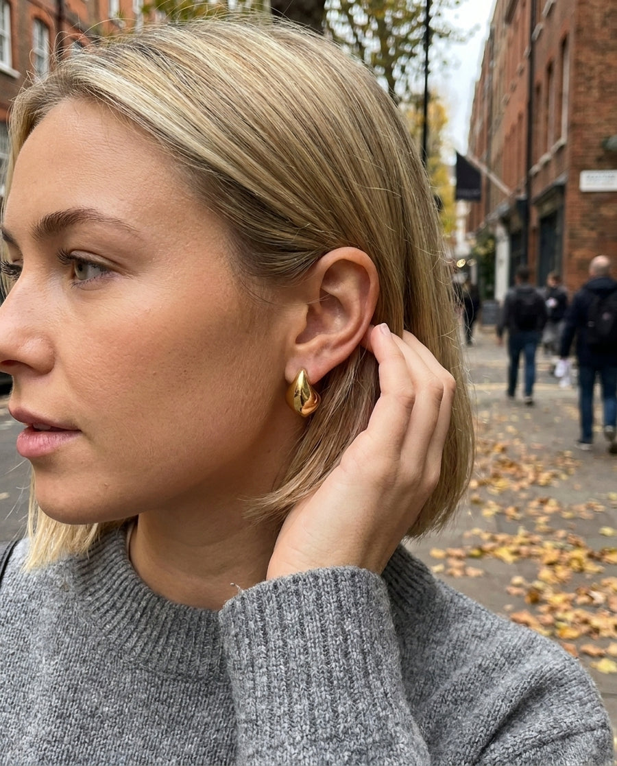 Mathilde Gold Drop Earrings styled with a knit jumper