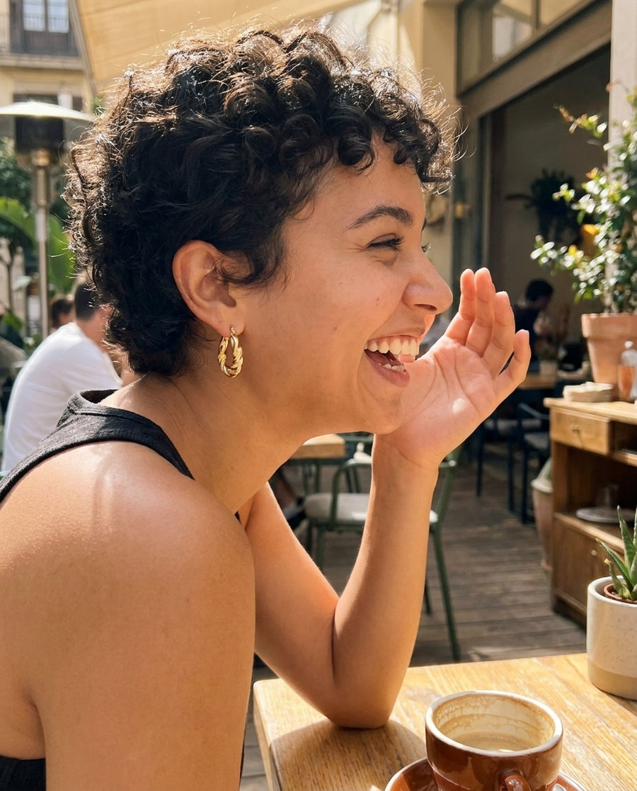 Sienna Twist Hoop Earrings styled at a cafe